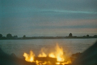Burning campfire on shore